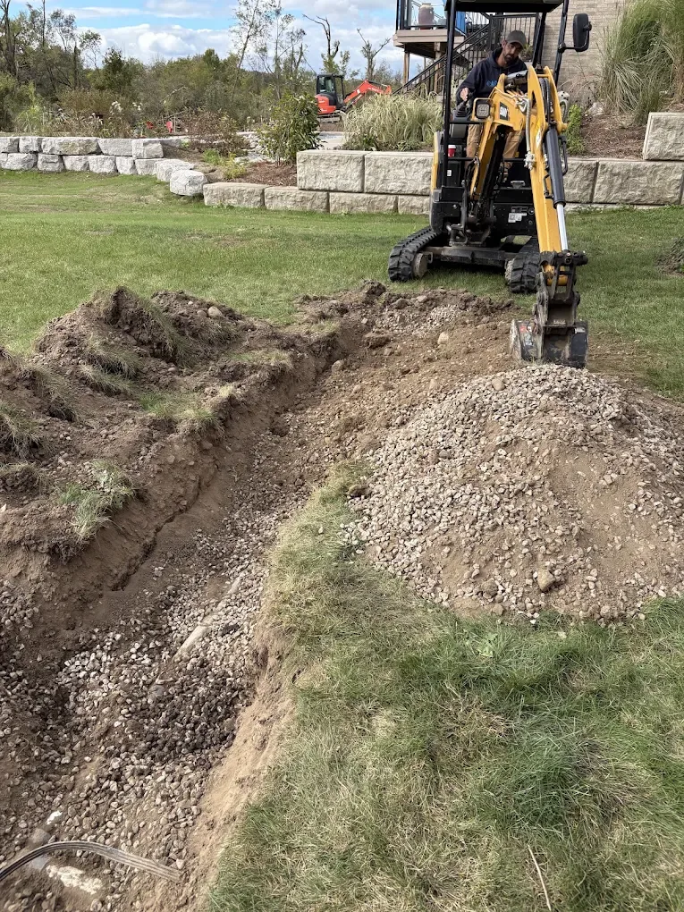 Bio-Bob's mini excavator on a septic system job