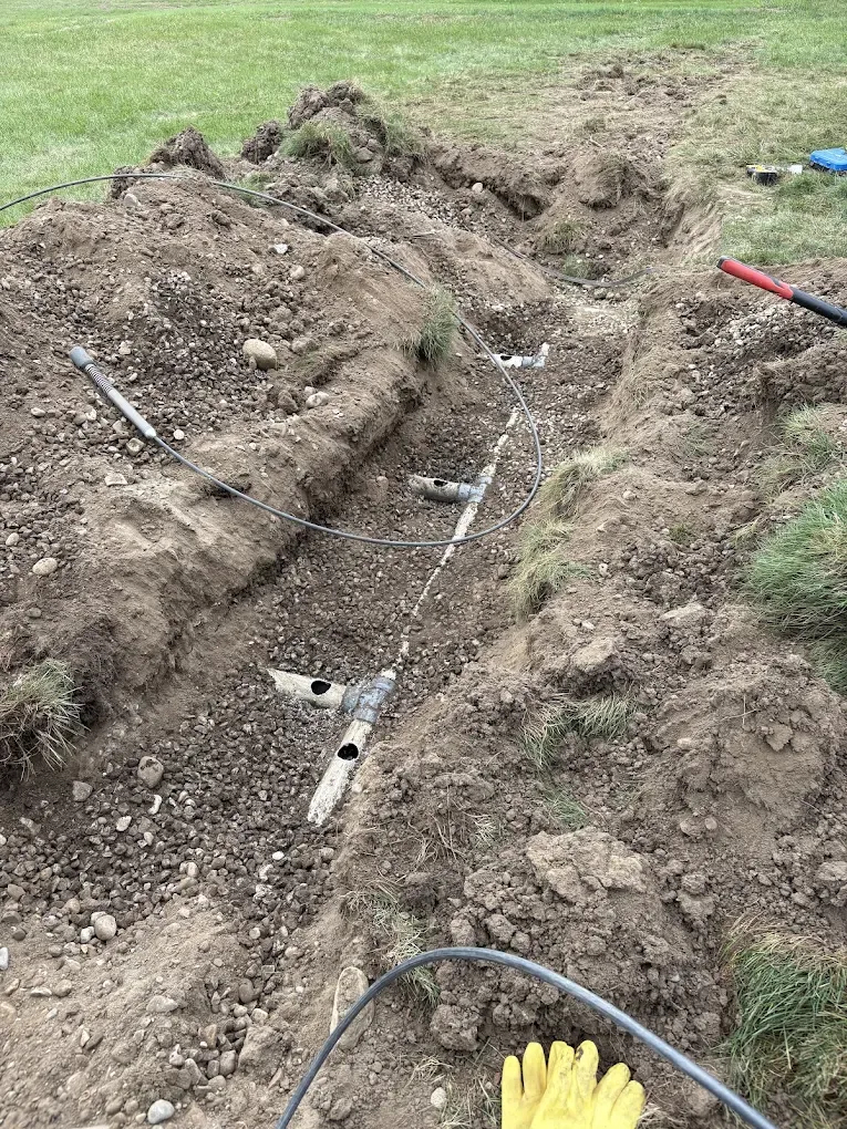 Weeping bed trench opened for septic system repair